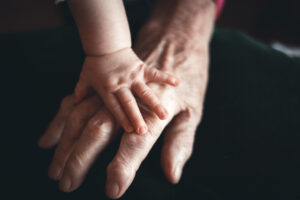 baby hand on old hand